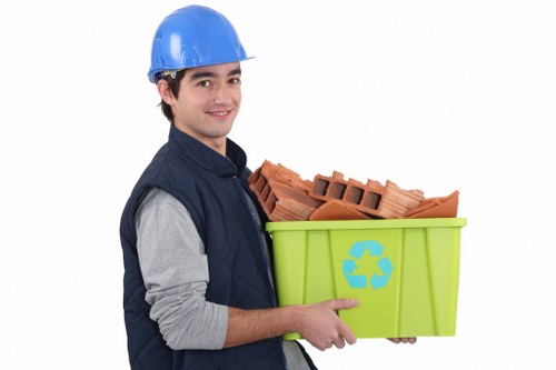 Residents sorting furniture for disposal in Redbridge
